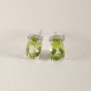 Peridot 1.0 Carat tw Oval Earrings in Sterling Silver